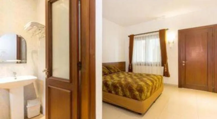 Bed in Hotel Adilla Syariah Ambarukmo