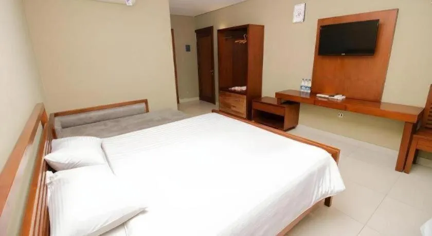 Bed in Hotel Adilla Syariah Ambarukmo