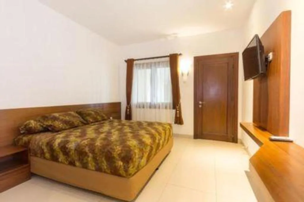 Bed in Hotel Adilla Syariah Ambarukmo