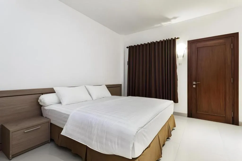 Bed in Hotel Adilla Syariah Ambarukmo