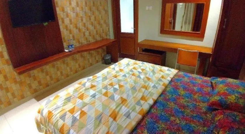 Bed in Hotel Adilla Syariah Ambarukmo