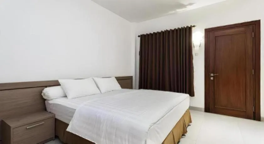 Bed in Hotel Adilla Syariah Ambarukmo