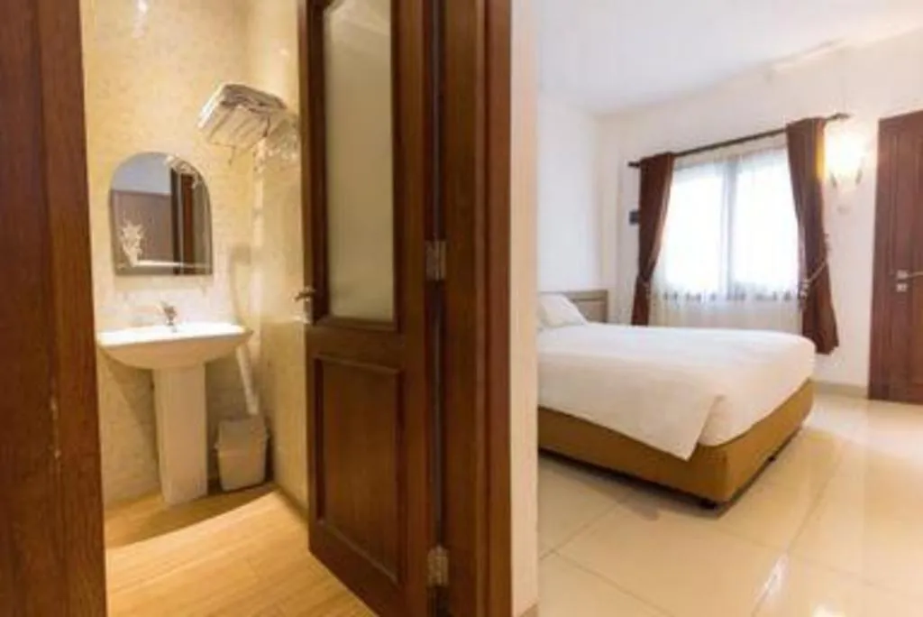 Bed in Hotel Adilla Syariah Ambarukmo