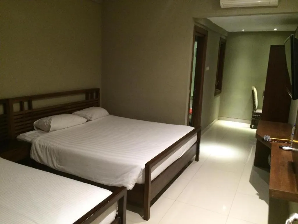 Bed in Hotel Adilla Syariah Ambarukmo