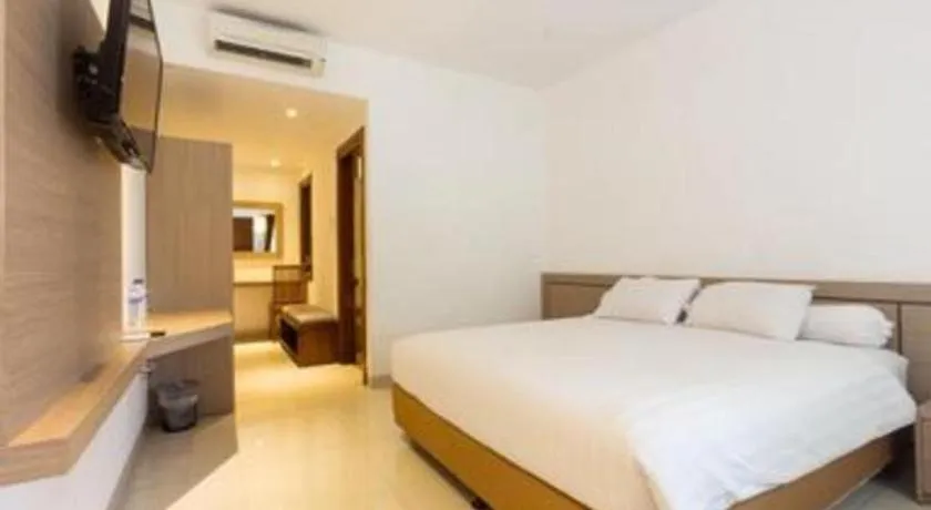 Bed in Hotel Adilla Syariah Ambarukmo