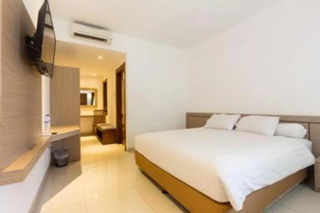 Bed in Hotel Adilla Syariah Ambarukmo