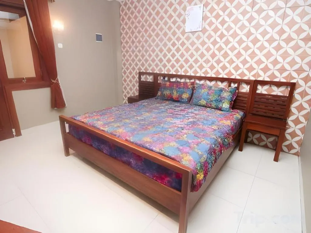 Bed in Hotel Adilla Syariah Ambarukmo