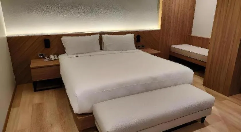 Bed in Butterfly Princess Hotel