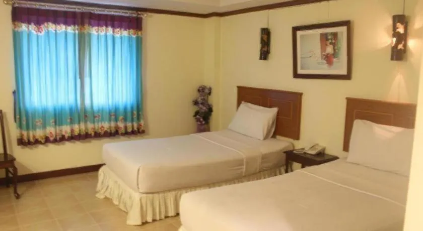 Bed in Butterfly Princess Hotel