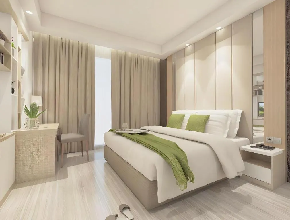 Bed in Hotel Dafam Pacific Caesar