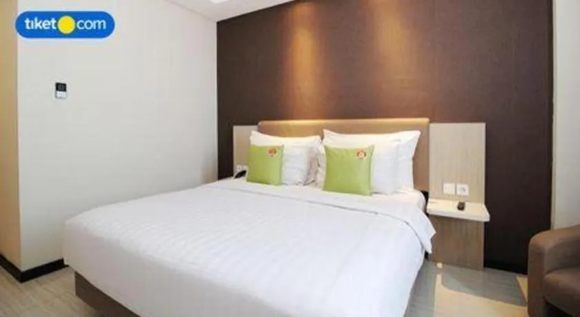 Bed in Hotel Dafam Pacific Caesar