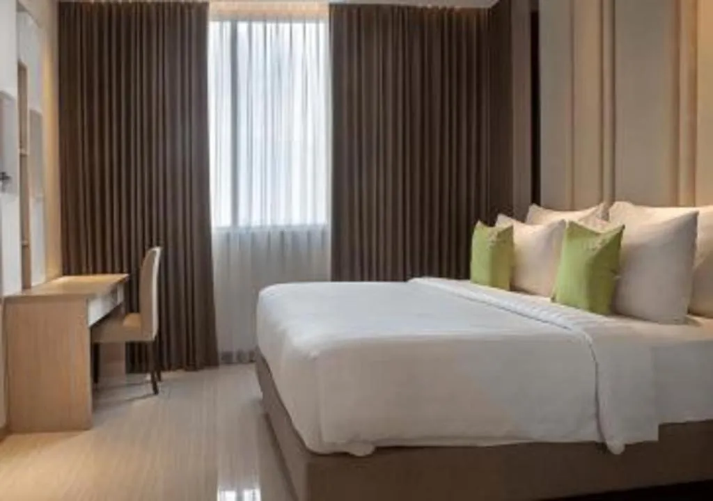 Bed in Hotel Dafam Pacific Caesar