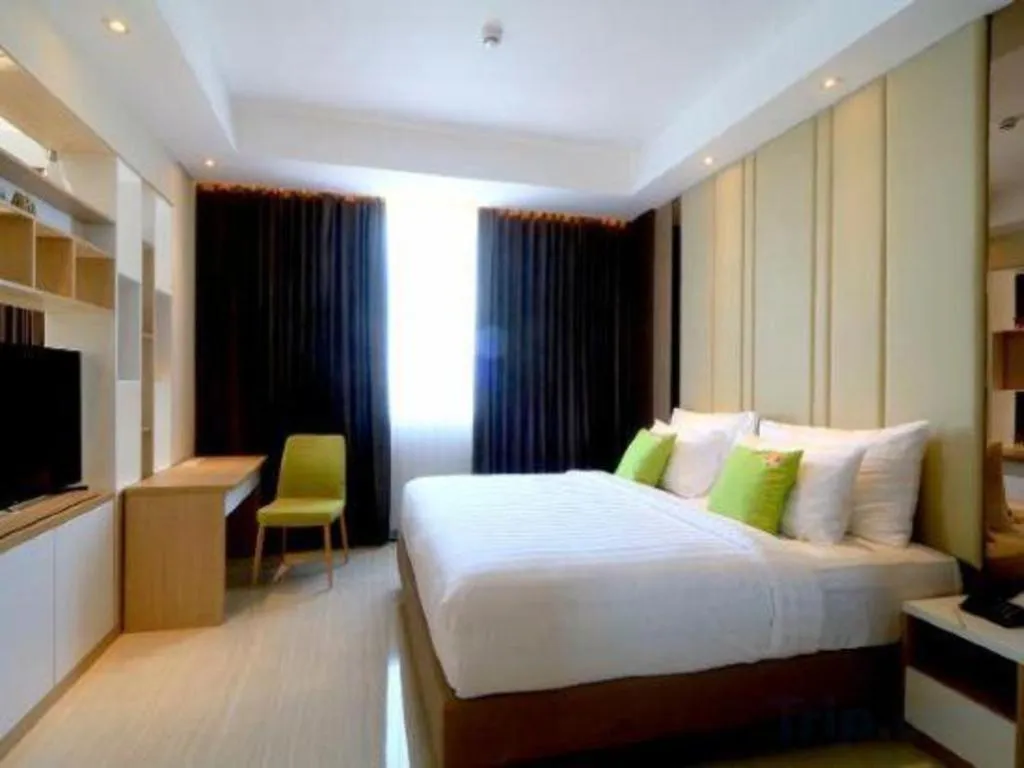 Bed in Hotel Dafam Pacific Caesar