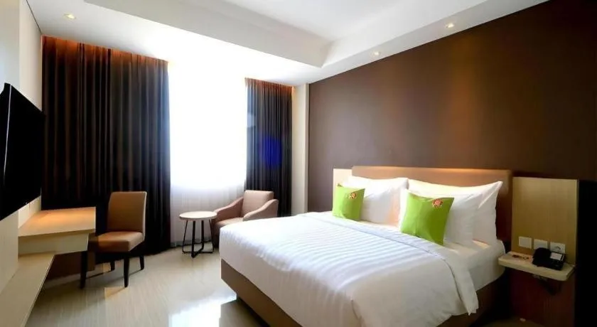 Bed in Hotel Dafam Pacific Caesar