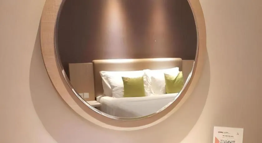 Bed in Hotel Dafam Pacific Caesar