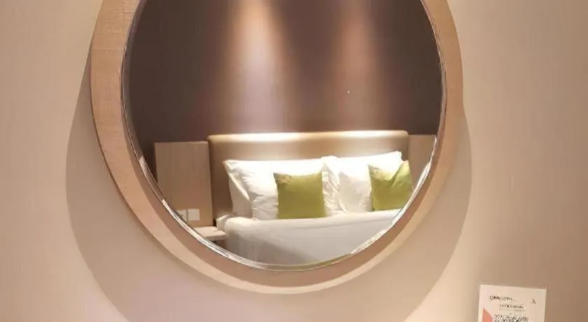 Bed in Hotel Dafam Pacific Caesar