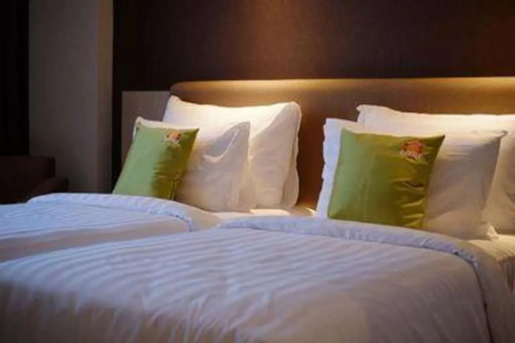 Bed in Hotel Dafam Pacific Caesar