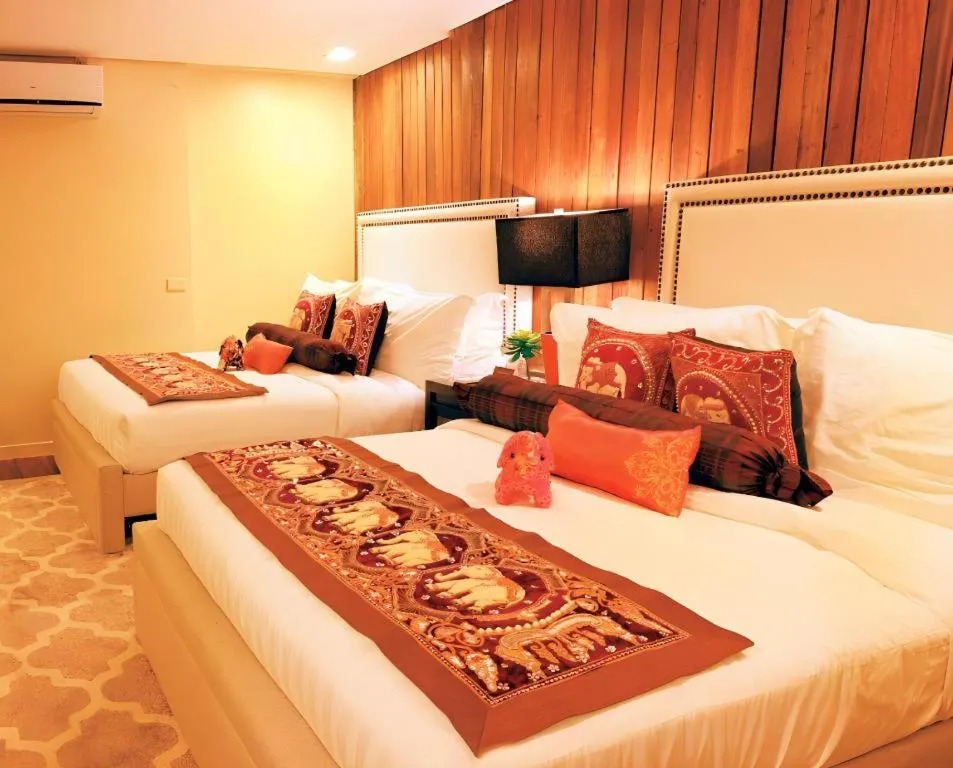 Bed in The Oriental Luxury Suites Tagaytay