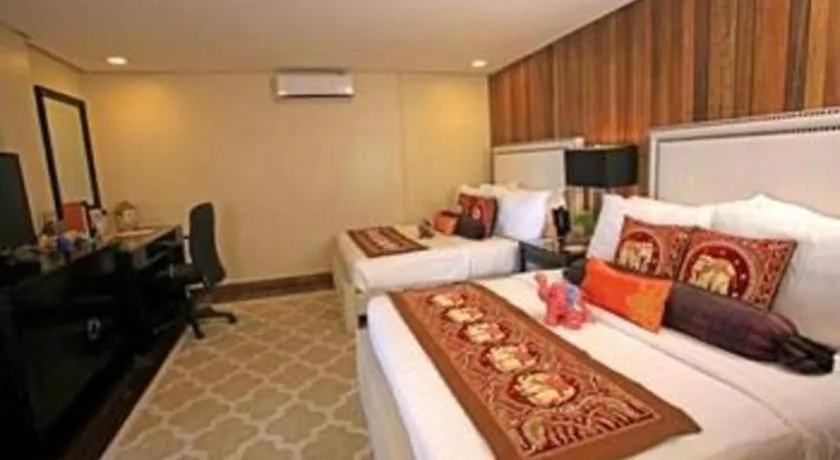 Bed in The Oriental Luxury Suites Tagaytay