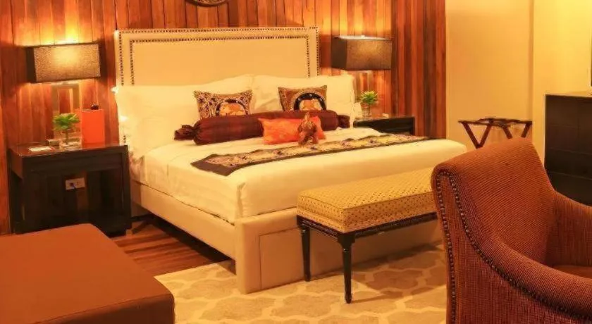 Bed in The Oriental Luxury Suites Tagaytay