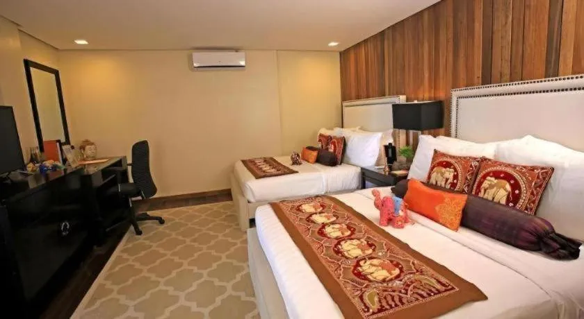 Bed in The Oriental Luxury Suites Tagaytay