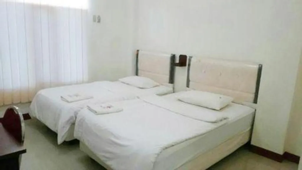 Bed in Avicenna Hotel