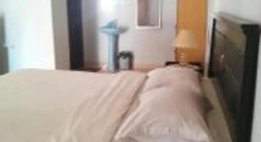 Bed in Avicenna Hotel