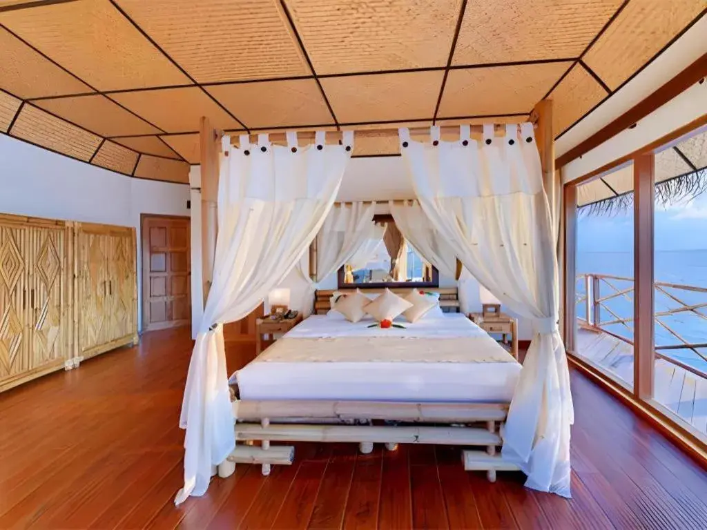 Bed in Angaga Island Resort and Spa Bed in Angaga Island Resort and Spa