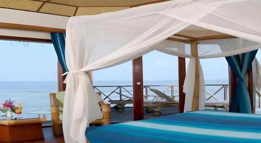 Bed in Angaga Island Resort and Spa