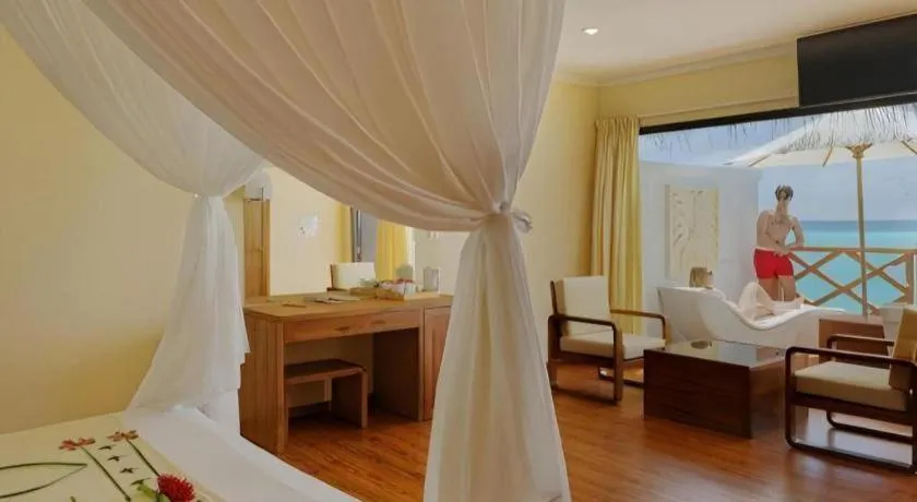 Bed in Angaga Island Resort and Spa