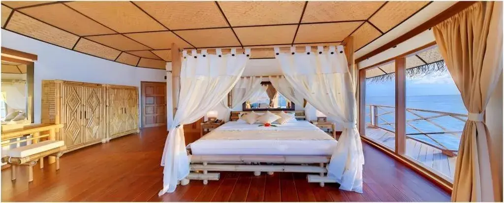 Bed in Angaga Island Resort and Spa Bed in Angaga Island Resort and Spa