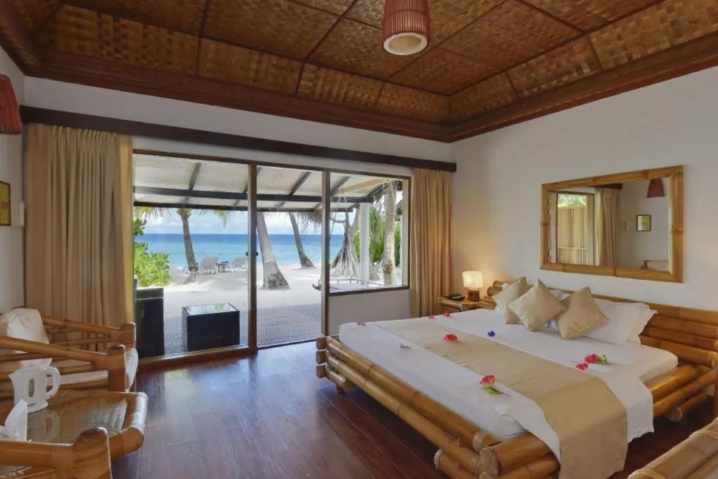 Bed in Angaga Island Resort and Spa