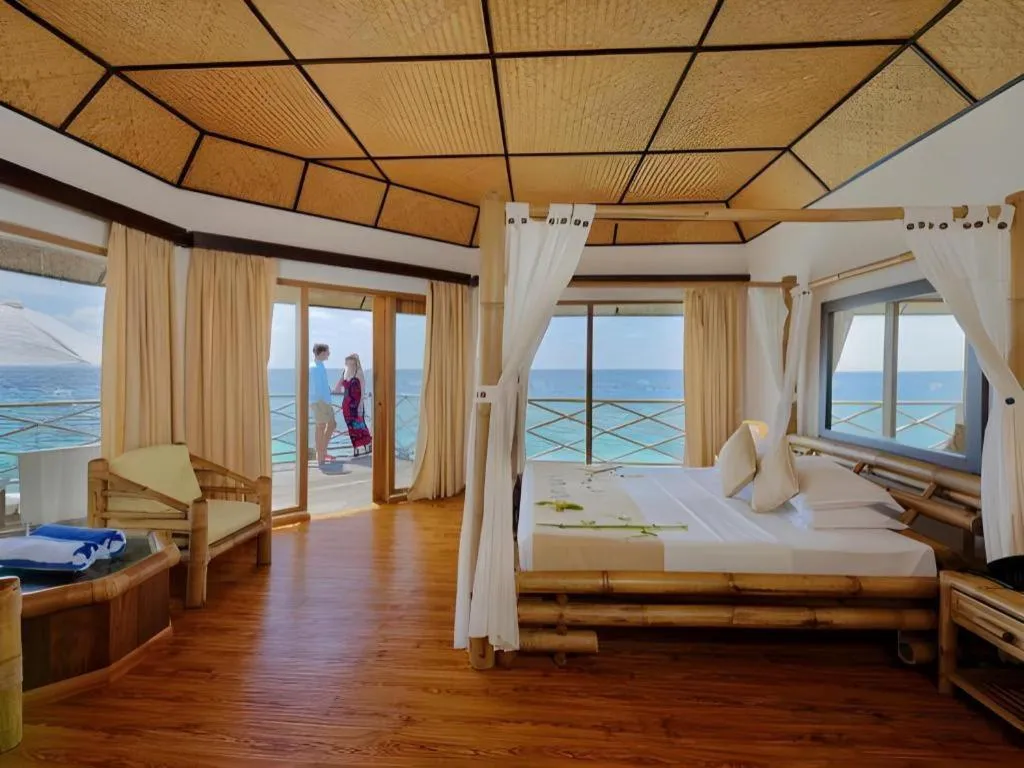 Bed in Angaga Island Resort and Spa