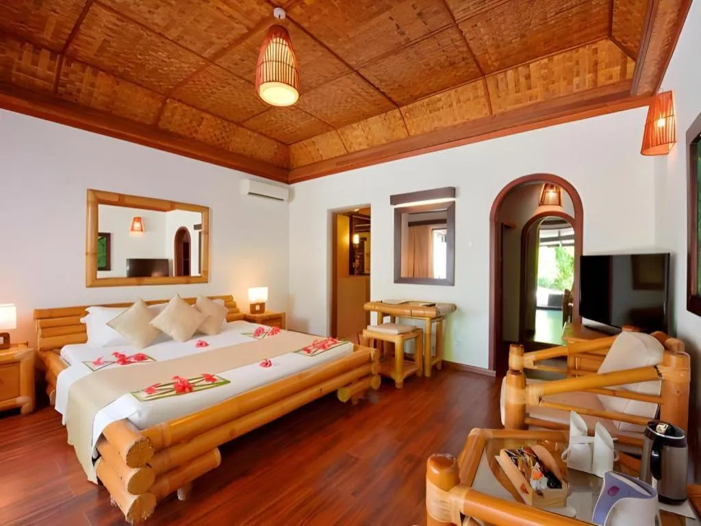 Bed in Angaga Island Resort and Spa