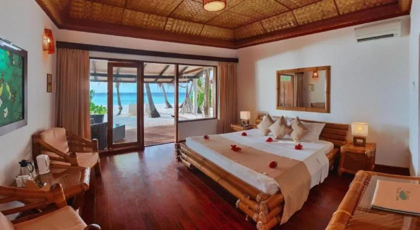 Bed in Angaga Island Resort and Spa