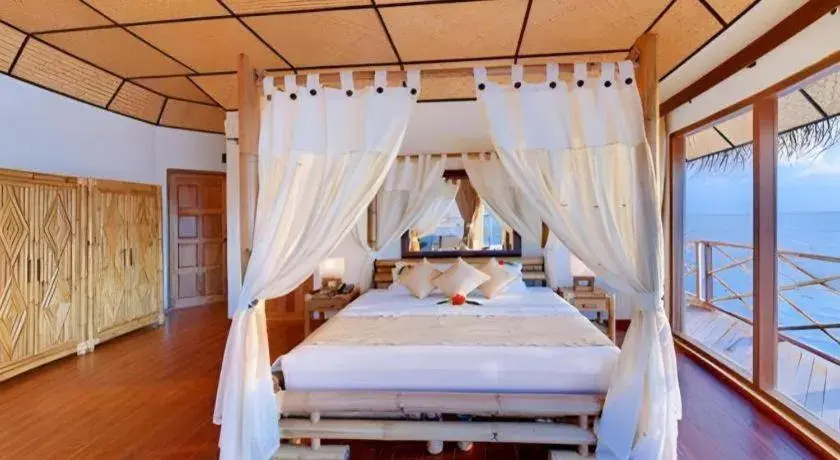 Bed in Angaga Island Resort and Spa Bed in Angaga Island Resort and Spa