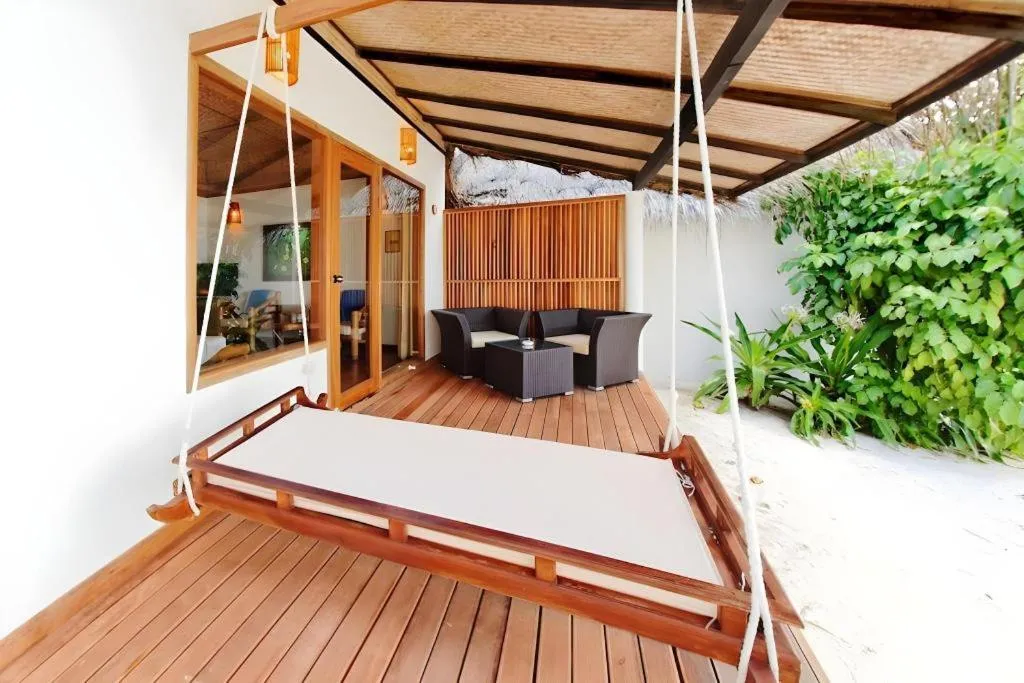 Bed in Angaga Island Resort and Spa