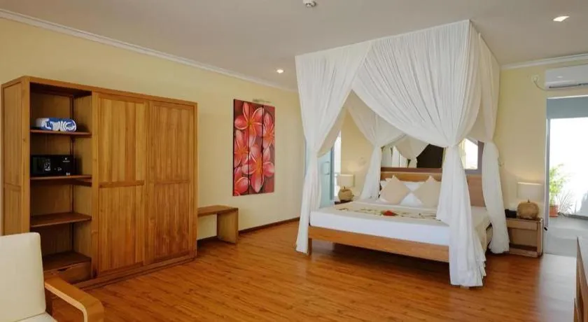 Bed in Angaga Island Resort and Spa