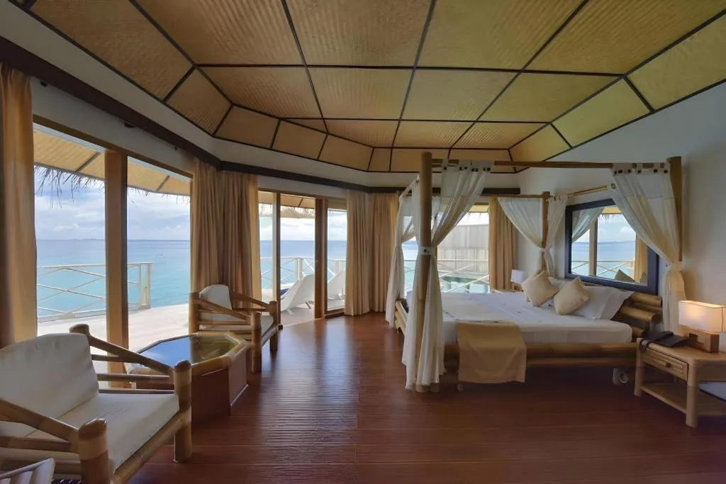 Bed in Angaga Island Resort and Spa