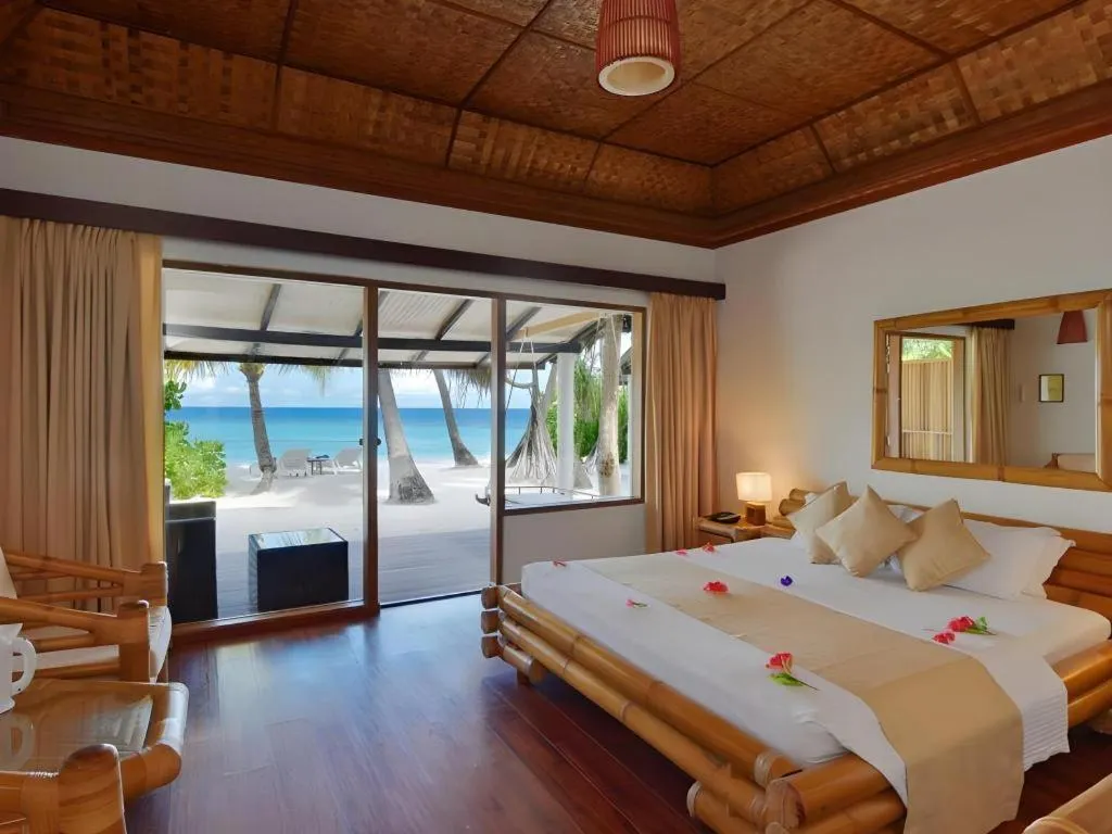 Bed in Angaga Island Resort and Spa