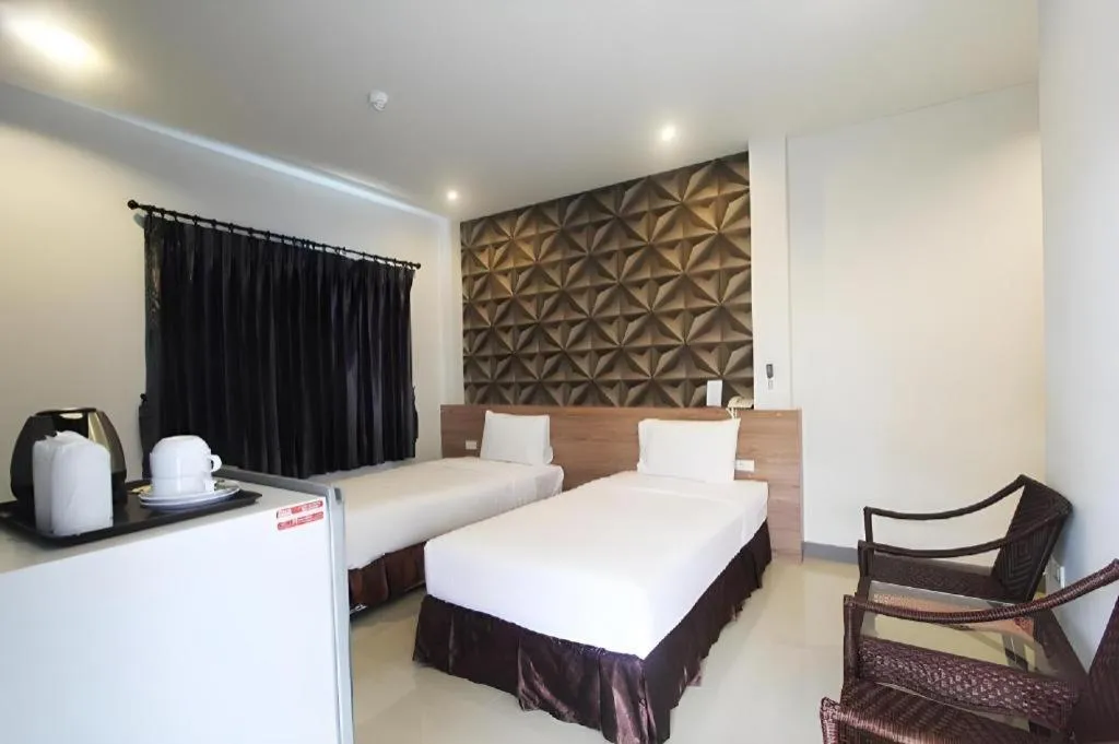 Bed in Seree Grand Resort