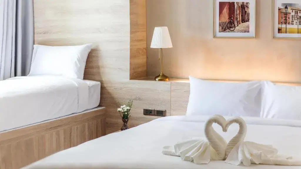 Bed in B2 Ubon Premier Hotel Bed in B2 Ubon Premier Hotel