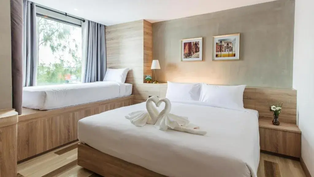 Bed in B2 Ubon Premier Hotel Bed in B2 Ubon Premier Hotel