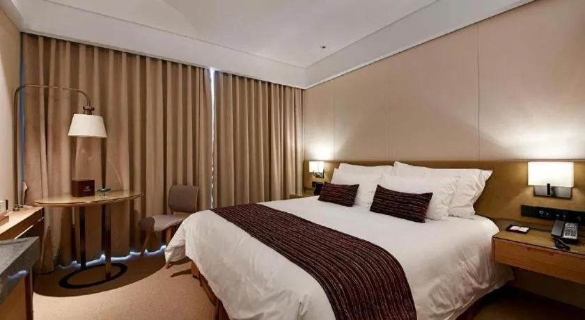 Bed in New Century Kylie Hotel Ningbo