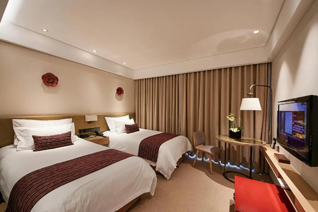 Bed in New Century Kylie Hotel Ningbo