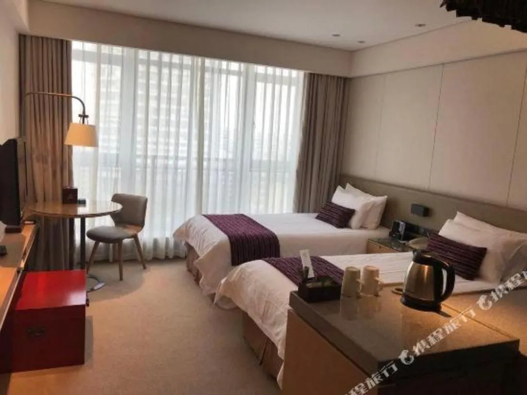 Bed in New Century Kylie Hotel Ningbo