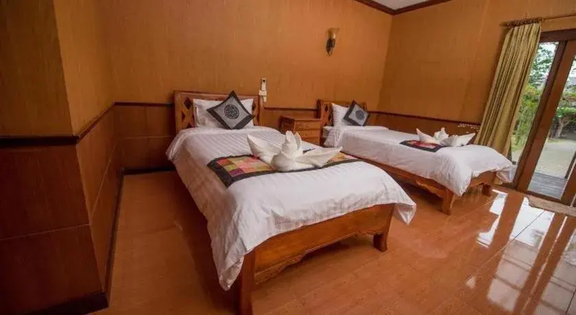 Bed in Baan Baitan Resort Bed in Baan Baitan Resort