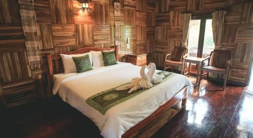 Bed in Baan Baitan Resort Bed in Baan Baitan Resort