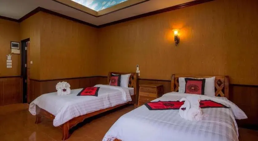 Bed in Baan Baitan Resort Bed in Baan Baitan Resort