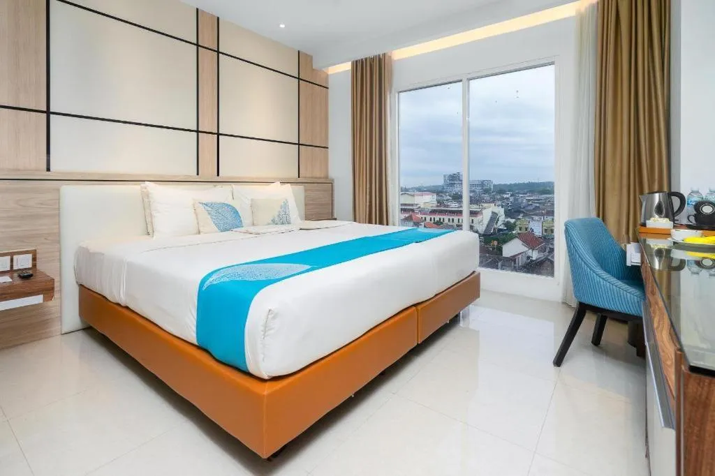 Bed in Java Lotus Hotel Jember